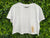 Bucketty's White Cropped T-shirt with Tan Graphic Design